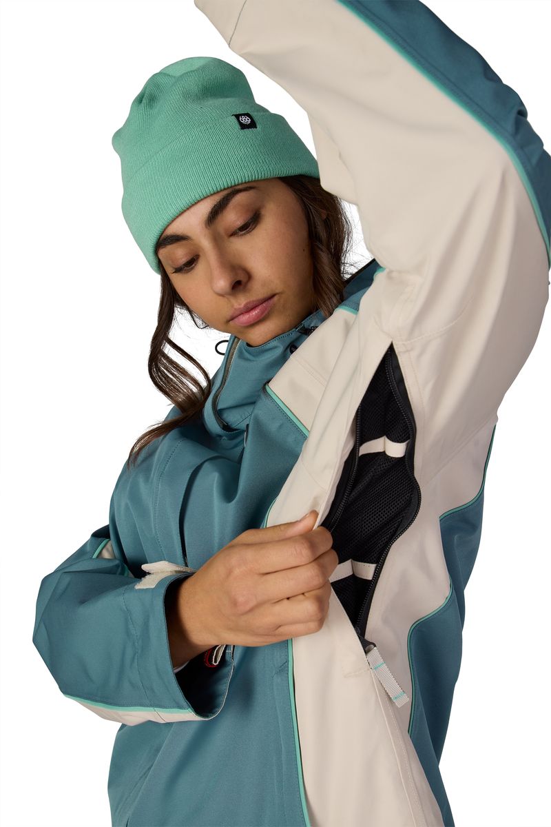 Teal hooded shell jacket with contrast cream sleeves and G66 logo