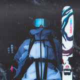 A person wearing a white jacket and blue pants, holding a pair of Salomon S/Lab QST Blank Skis 2026.