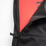 Ride Unforgiven Sleeve Snowboard Bag - A black snowboard bag with a zipper and handle, featuring a red interior lining.