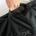 Ride Unforgiven Sleeve Snowboard Bag - Black snowboard bag with a zippered top and handle on top.