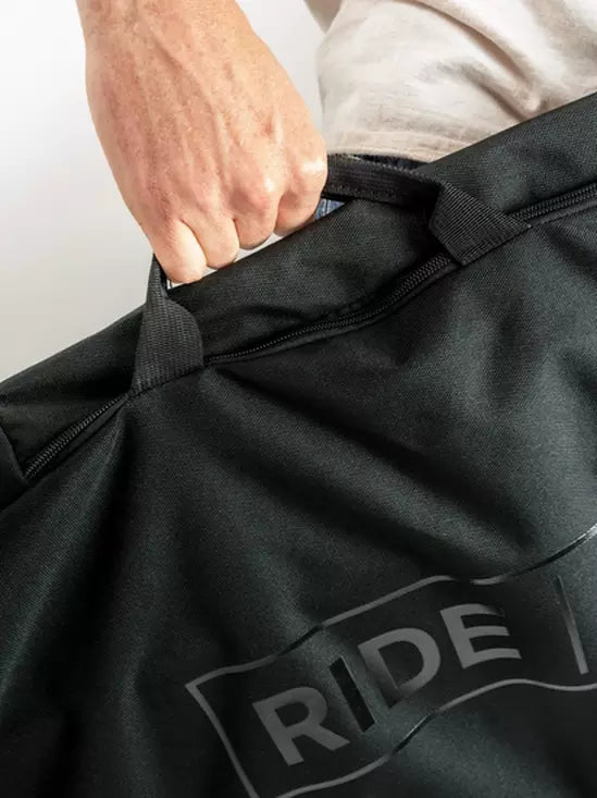 Ride Unforgiven Sleeve Snowboard Bag - Black snowboard bag with a zippered top and handle on top.