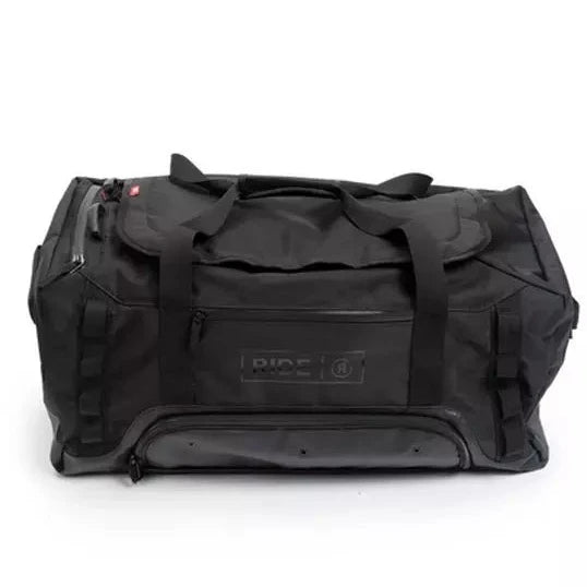 Ride Duffle Bag 2025 - Black duffel bag with zippered top and handle on side.