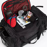 Ride Duffle Bag 2025 - Black duffel bag with red interior lining and black zipper.