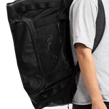 Ride Duffle Bag 2025 - Black duffel bag with zippered pockets and handle on top.