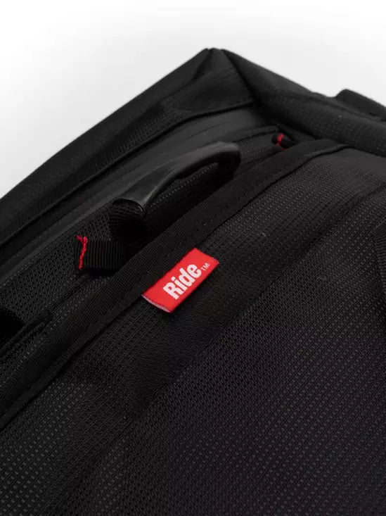 Ride Duffle Bag 2025 - Black duffel bag with red logo on front.