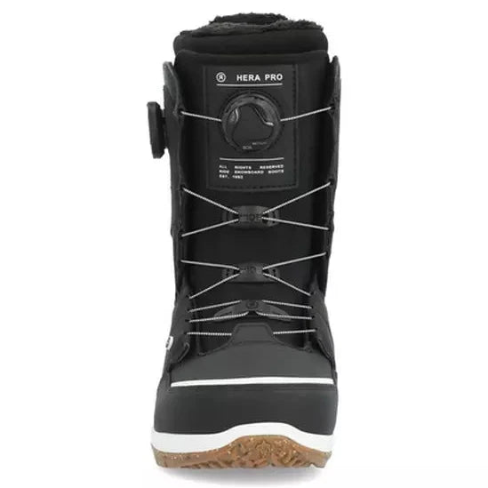 Ride Women's Hera Pro Snowboard Boot 2024 - Black snowboard boot with white accents and a black strap on the side.