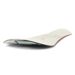 Ride Women's Compact Snowboard 2025 - A white snowboard with black and gray abstract design on top, featuring a red stripe along the bottom edge.