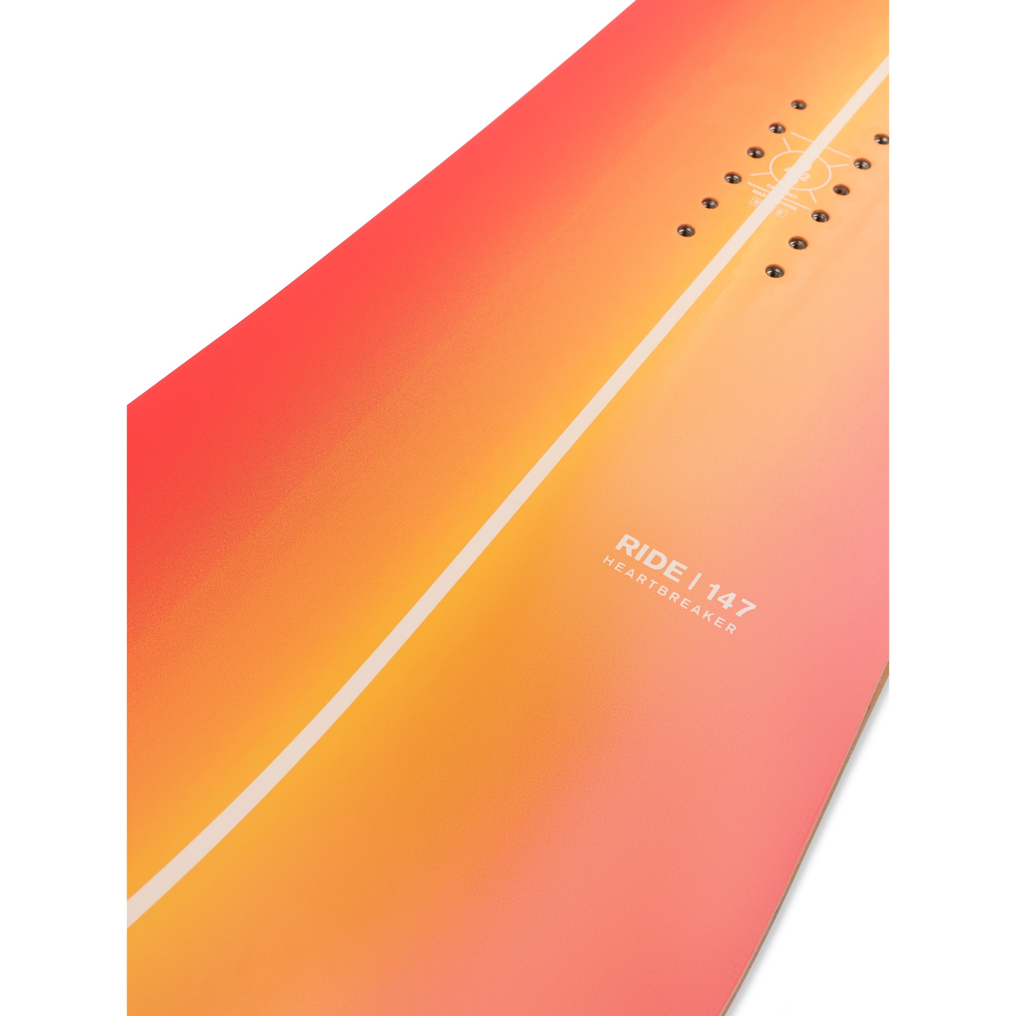 Ride Women's Heartbreaker Snowboard 2025 - A snowboard with a gradient design that transitions from orange to pink, featuring a white line running diagonally across it.