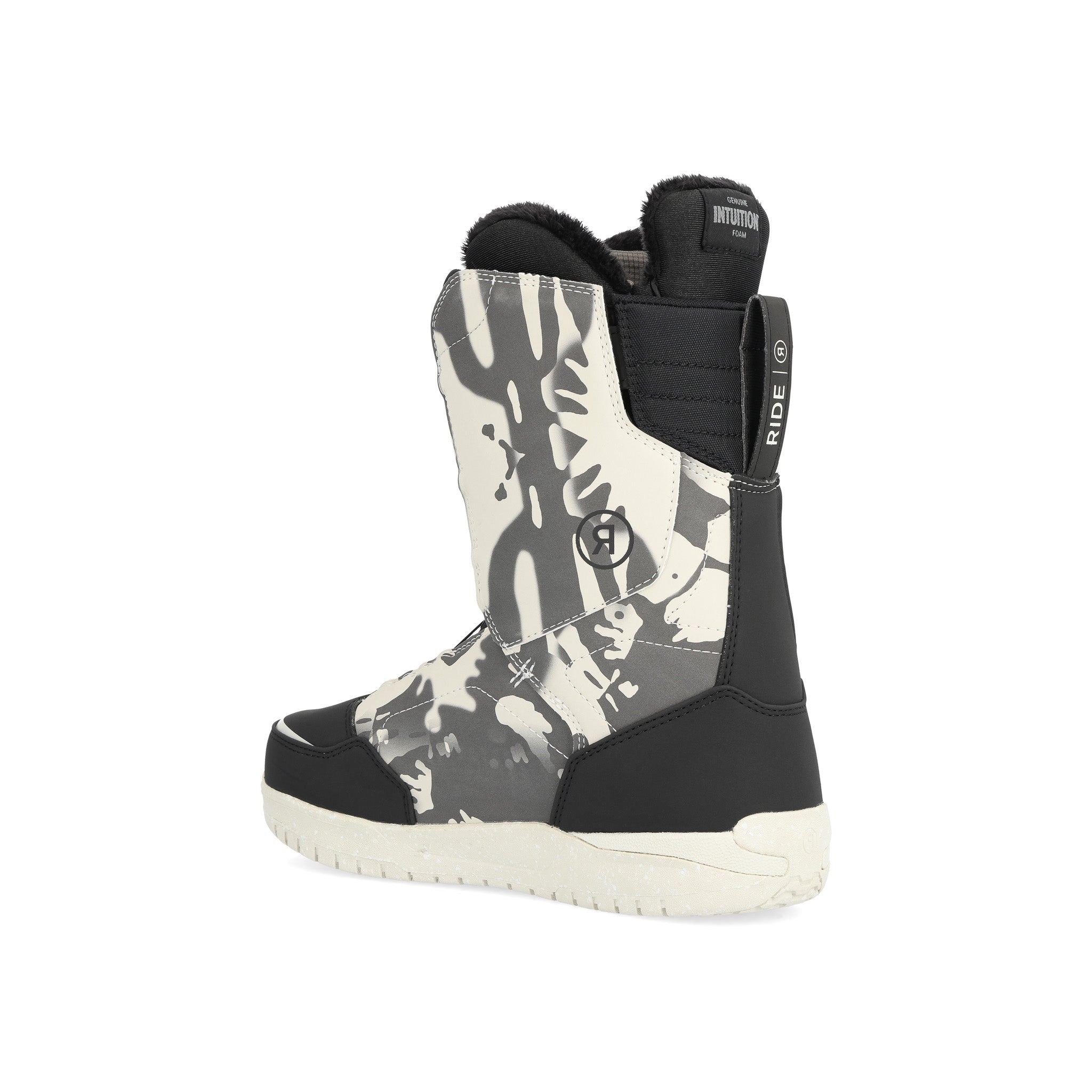 Ride Women's Hera Snowboard Boot 2025 - A black snowboard boot with a white and grey abstract pattern on the side, featuring a strap that says "RIDE" in white letters.