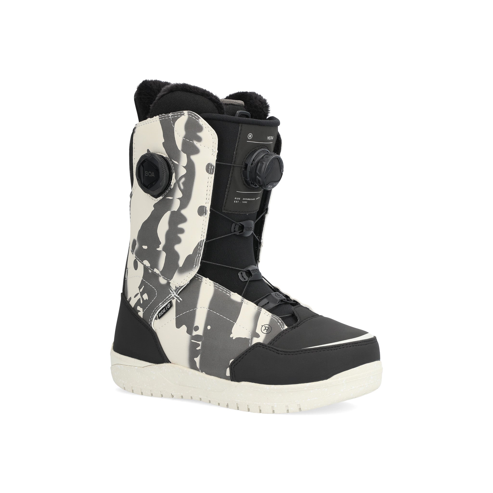 Ride Women's Hera Snowboard Boot 2025 - A black snowboard boot with a white and grey abstract pattern on the side, featuring a round BOA dial on the top.