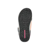 Ride Women's Karmyn Zonal Snowboard Boot 2025 - A black snowboard boot with a pink and white stripe on the side, featuring a strap closure system.