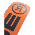 Ride Junior's Lowride Snowboard 2025 - A bright orange snowboard with a black logo featuring a stylized "R" in lowercase letters, positioned at the top of the board.
