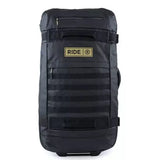 Ride Luggage Roller Snowboard Bag 2025 - A black roller bag with a handle on top and wheels at the bottom, featuring a zippered pocket on the front.