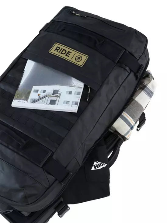 Ride Luggage Roller Snowboard Bag 2025 - Black bag with a white logo on the front and a handle at the top.