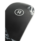 Ride Women's Magic Stick Snowboard 2025 - A black snowboard with a white logo featuring a stylized "R" in a circle, and a white graphic of a woman riding on the top right corner.