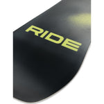 Ride Manic Snowboard 2025 - A black snowboard with a yellow logo on top, featuring the word "Manic" in bold letters.
