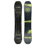 Ride Manic Snowboard 2025 - A black snowboard with a yellow logo featuring a stylized "R" in a circle, and a pattern of abstract shapes resembling paint splatters or brushstrokes.