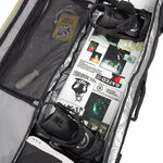 Ride The Perfect Snowboard Bag 2025 - A large, gray snowboard bag with a zippered top and two black wheels on one end.