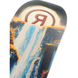 Ride Shadowban Snowboard 2025 - A snowboard with a black base and white, blue, and orange graphics of mountains and trees.