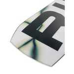 Ride Warpig Snowboard 2025 - A white snowboard with a black "Warpig" logo on top and a green, yellow, and blue abstract design along the bottom edge.