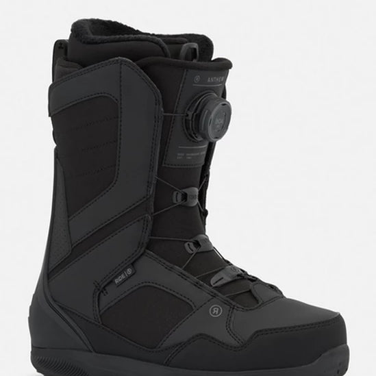 Black snowboard boots with BOA dial, lace straps, and padded ankle collar