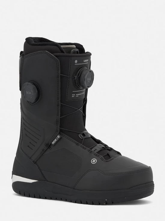 Black snowboard boots with BOA dial, ankle straps, and padded tongue