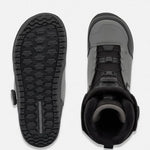 Snowboard boot sole and side view in dark color with grip tread