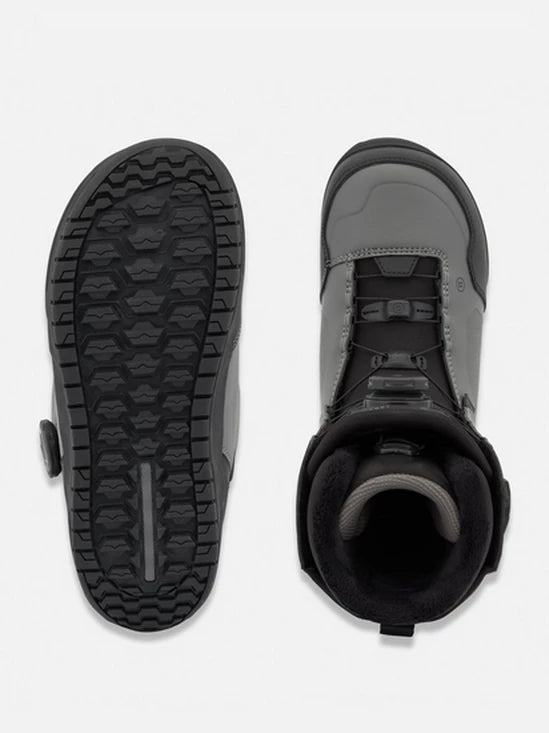 Snowboard boot sole and side view in dark color with grip tread