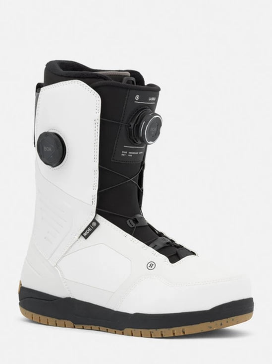 White snowboard boots with black accents, BOA dial, and lace closure