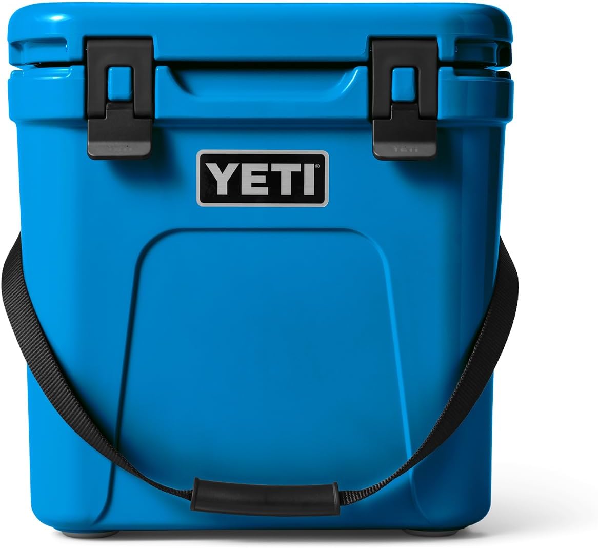 Yeti - Roadie 24 Hard Cooler with a dark gray lid, two side handles, and a drain plug on the bottom.