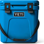 Yeti - Roadie 24 Hard Cooler with a dark gray lid, two side handles, and a drain plug on the bottom.