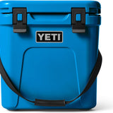 Yeti - Roadie 24 Hard Cooler with a dark gray lid, two side handles, and a drain plug on the bottom.