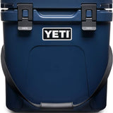 Yeti Roadie 24 Hard Cooler - A navy blue cooler with a handle on top and two latches on the front.