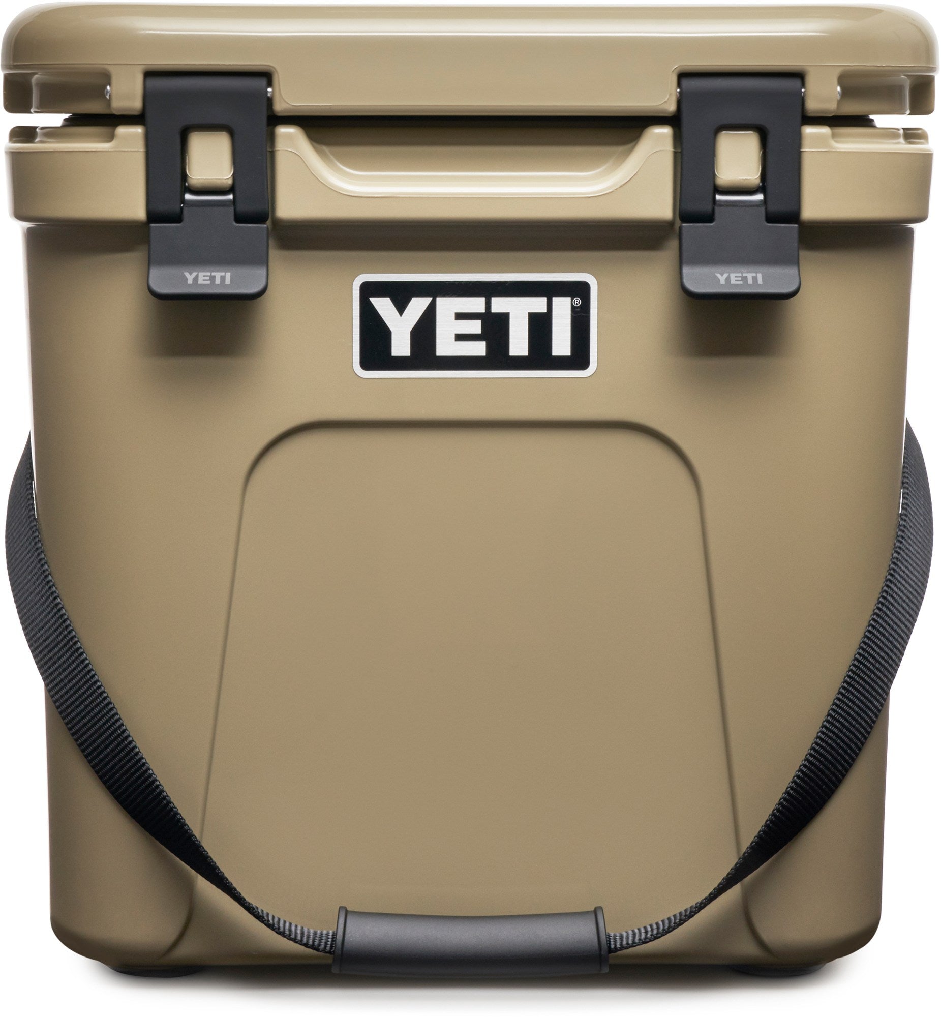 Yeti Roadie 24 Hard Cooler - A tan cooler with a handle on top and two latches on either side of it.