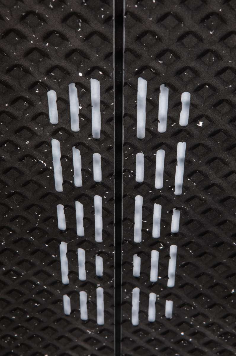 Ronix Flyweight Pro DNA Wakesurf Board 2024 - A black wakesurf board with a diamond pattern on its bottom and a white logo that reads "DNA" in the center.