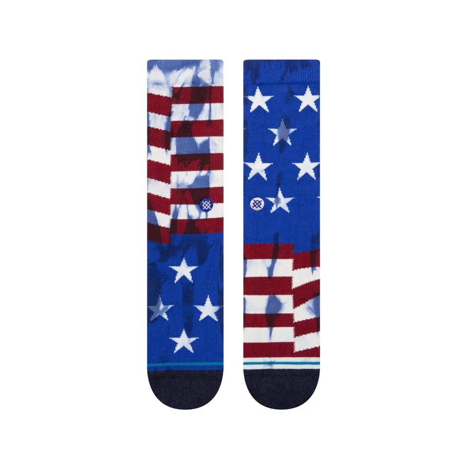 THE BANNER CREW C SOCK 2023 - A pair of crew socks with a red and white striped pattern resembling an American flag, featuring stars on the toes.