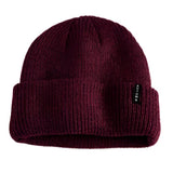 Autumn Select Beanie 2025 - A burgundy beanie with a folded cuff and a small black tag on the front.