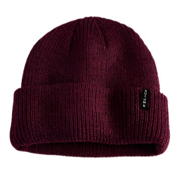 Autumn Select Beanie 2025 - A burgundy beanie with a folded cuff and a small black tag on the front.
