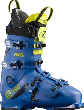 Salomon S/Pro 130 Ski Boots 2022 - A pair of blue ski boots with black buckles and straps, featuring a yellow logo on the side.