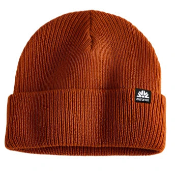 Autumn Simple Beanie 2025 - A rust-colored beanie with a ribbed texture and folded cuff, featuring a small black tag on the front.