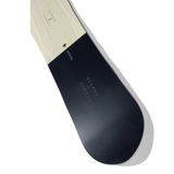 Arbor Single Snowboard 2026 - A light-colored wood grain snowboard with a black stripe at the top and bottom.