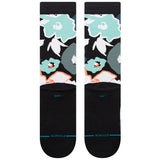 Stance Flower Beds Crew Socks 2024 - A pair of crew socks with a floral pattern in shades of blue, white and orange on a black background.