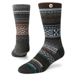 Windy Peaks Perf Crew 2024 - A pair of dark gray crew socks with a subtle pattern of lighter gray and brown lines, featuring white accents at the top and bottom.