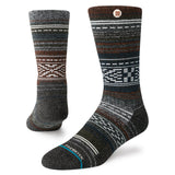 Windy Peaks Perf Crew 2024 - A pair of dark gray crew socks with a subtle pattern of lighter gray and brown lines, featuring white accents at the top and bottom.