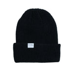 Coal Stanley Mid Length Beanie 2025 - A black beanie with a white rectangular label on the front that says "COAL" in gray letters.