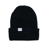 Coal Stanley Mid Length Beanie 2025 - A black beanie with a white rectangular label on the front that says "COAL" in gray letters.