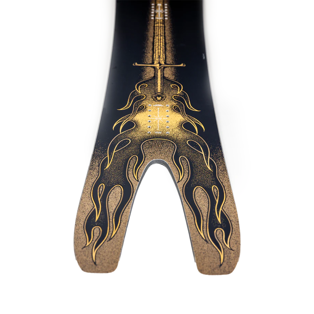 Nitro Stiletto RS x Drew Hicken Snowboard 2026 - A black snowboard with a gold sword graphic and flames on the tail.