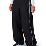 Black shell pants with elastic waistband, side piping, and cuffed hems