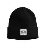 Coal Uniform Mid Knit Beanie 2025 - A black beanie with a white rectangular patch on the front featuring the word "COAL" in large letters and smaller text below reading "NECESSITIES FOR FINE LIVING".