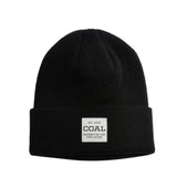 Coal Uniform Mid Knit Beanie 2025 - A black beanie with a white rectangular patch on the front featuring the word "COAL" in large letters and smaller text below reading "NECESSITIES FOR FINE LIVING".